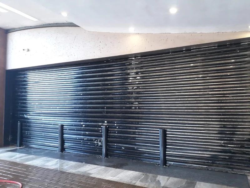 Black store-front shutter: 